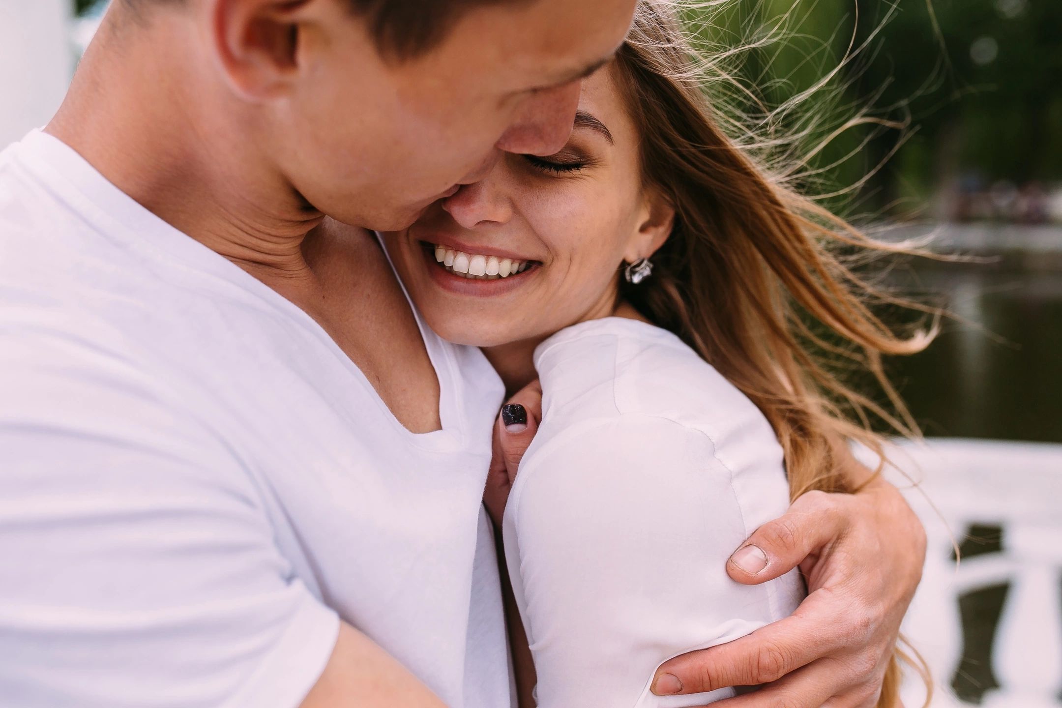 Man hugging woman